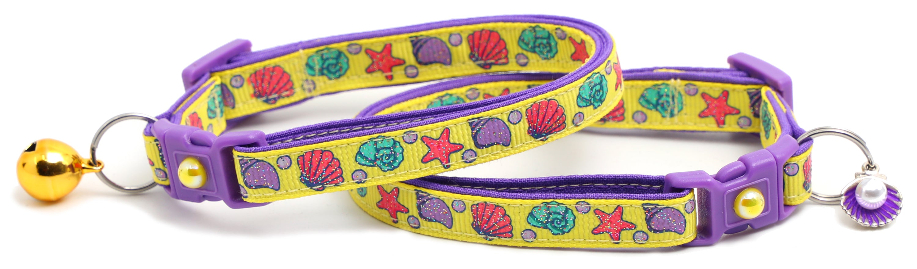 Beachcomber Breakaway Cat Collar in vibrant colors, featuring a breakaway clip and removable bell, made from soft reinforced cotton.